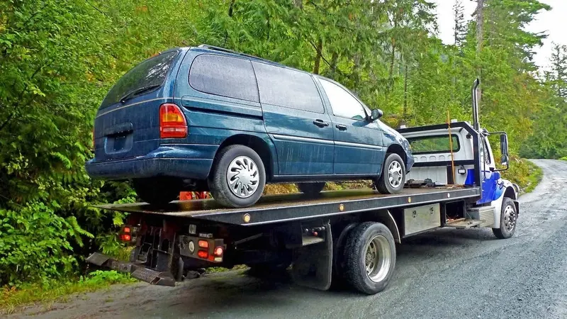 Hamilton flatbed towing a cargo van